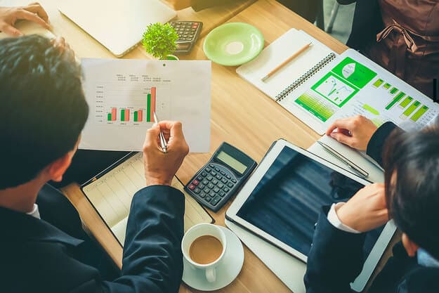 Building with solar panels and green terraces